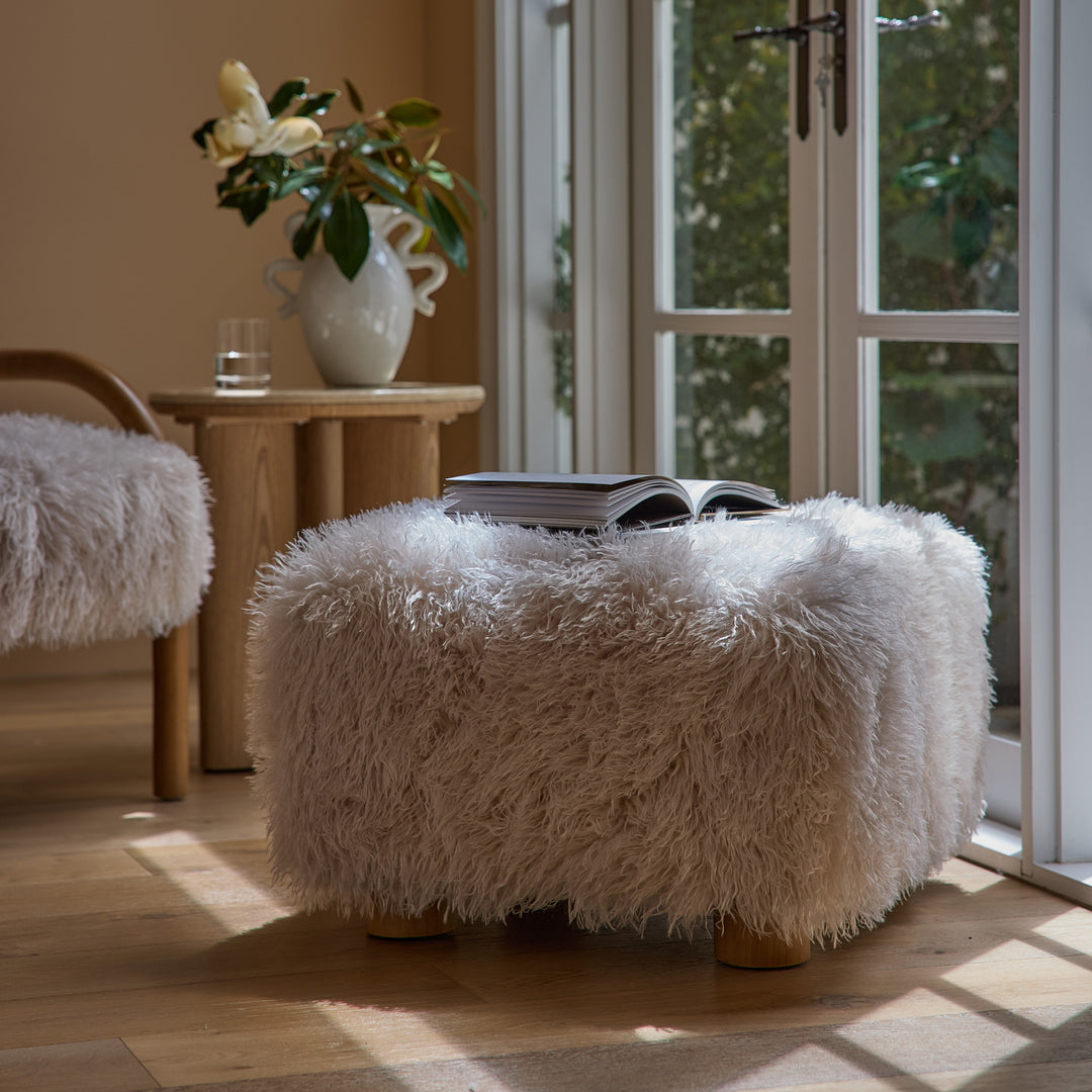 Kristoff Ivory Faux Fur Ottoman